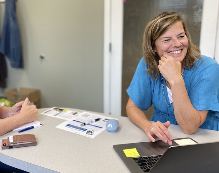 Carol at a client meeting enjoying the conversation!